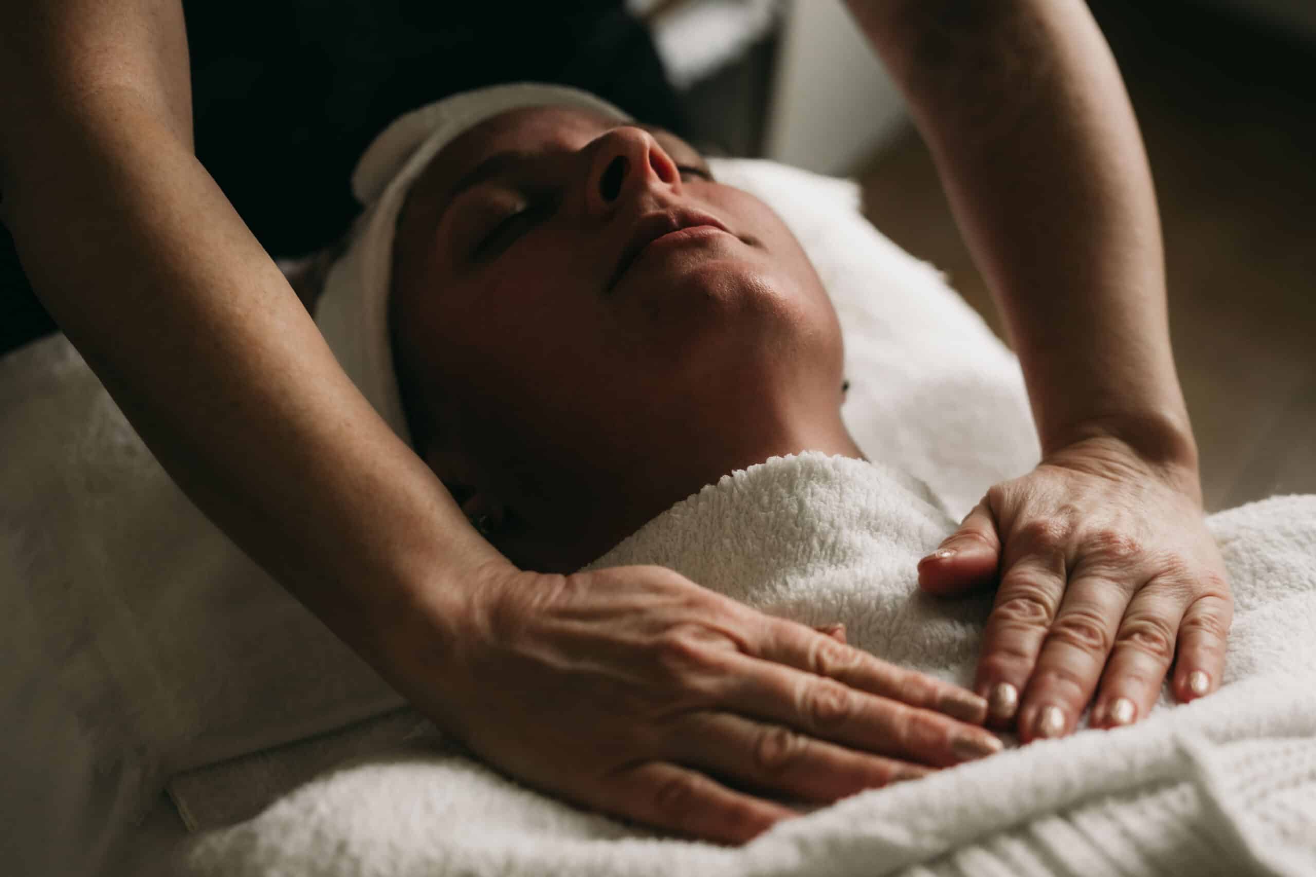 Relaxing woman receiving massage at spa or wellness center, peaceful treatment session, calm environment, professional massage therapy, skincare and relaxation service, healthy lifestyle.