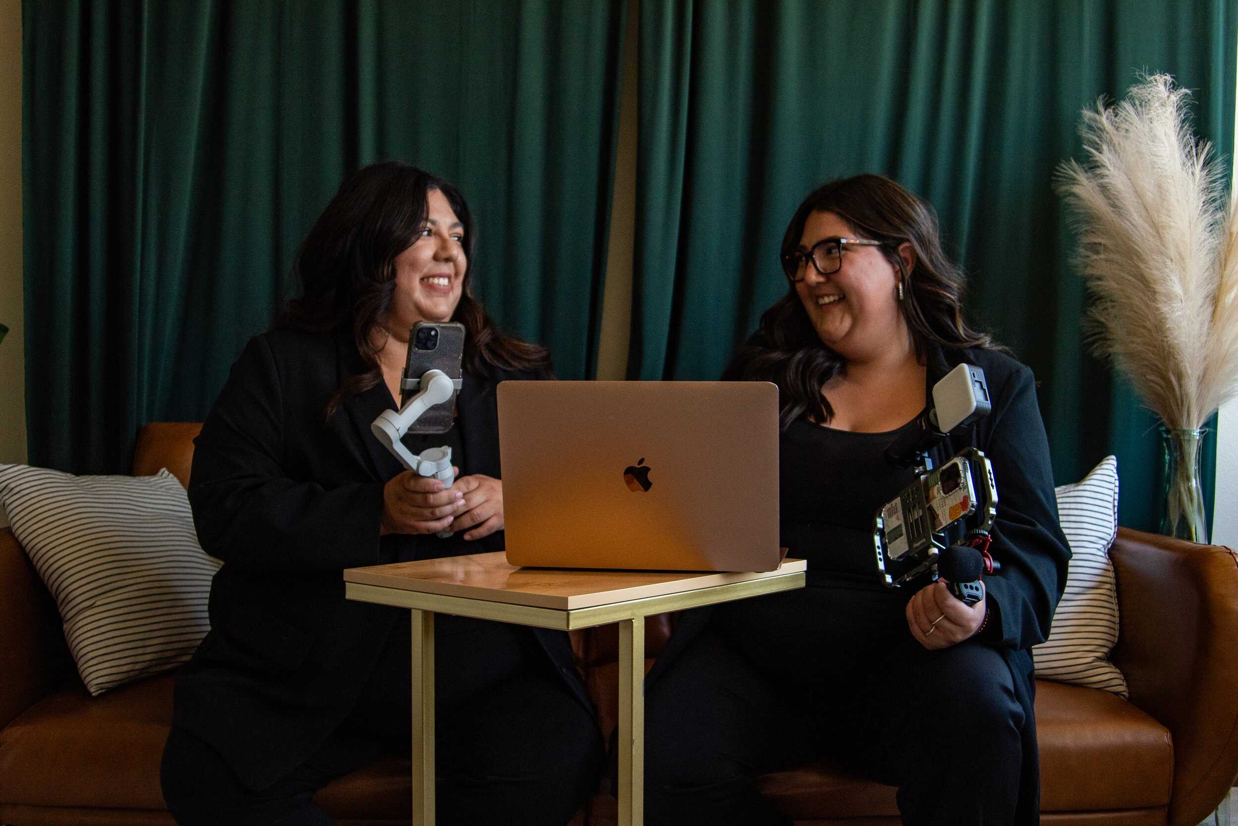 Behind-the-scenes of women content creators filming TikTok videos at home with a laptop, smartphones, and camera equipment, showcasing digital content creation and social media influencer activities.